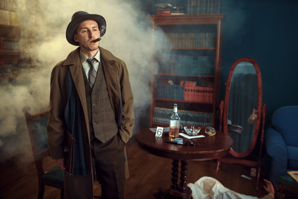 Smoky room with a man in a 1940s detective outfit (fedora, trench coat, vest) smoking a cigar, standing beside a round table with a bottle and papers.