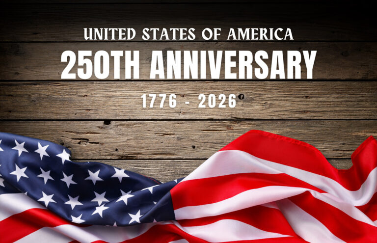 Banner-style image celebrating the United States’ 250th anniversary, with a waving American flag over a wooden backdrop and the text '1776–2026'