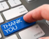 Blue 'THANK YOU' key being pressed on a keyboard, symbolizing gratitude or appreciation.