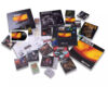 Collection of Metallica Reload-era memorabilia: CDs, vinyl sleeves, booklets and posters scattered around.