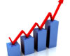 Upward-trending bar chart with a red arrow showing growth increasing from left to right (business growth concept).